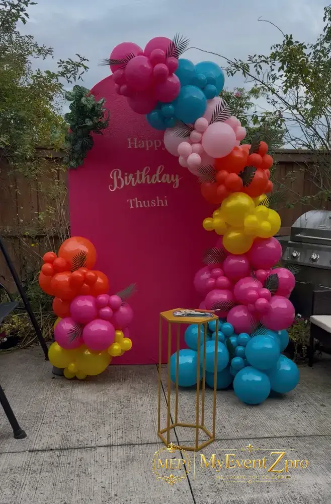 Vibrant Pink Arch Backdrop & Tropical Organic Balloon Garland Setup