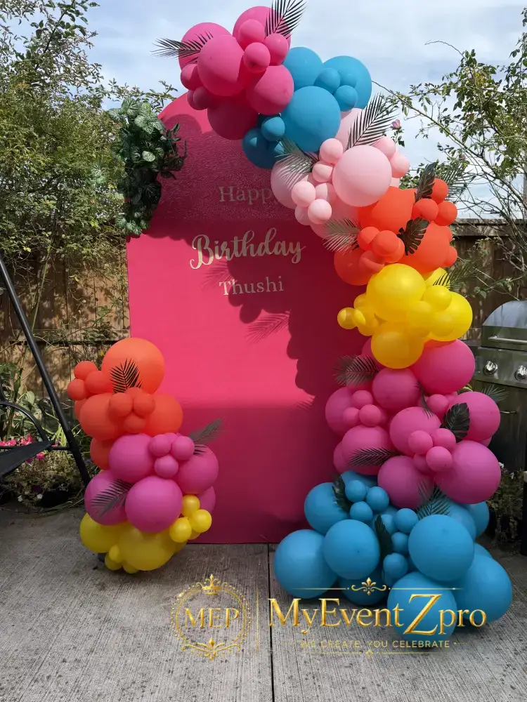Vibrant Pink Arch Backdrop & Tropical Organic Balloon Garland Setup